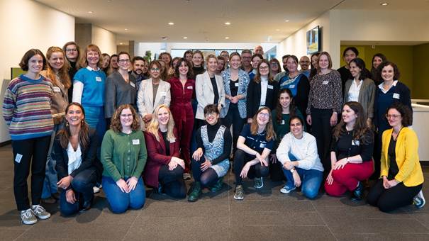 A group of people posing for a photo
Description automatically generated